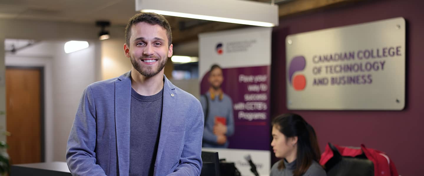 Student smiling and looking at the camera